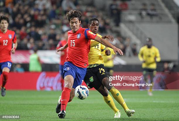 Deshorn Brown of Jamaica competes for the ball with Hong Jeong-Ho of South Korea during the international friendly match between South Korea and...