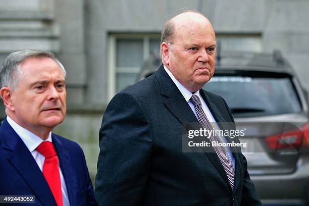 Michael Noonan, Ireland's finance minister, right, and Brendan Howlin, Ireland's public spending minister, arrive for a photo opportunity, before...