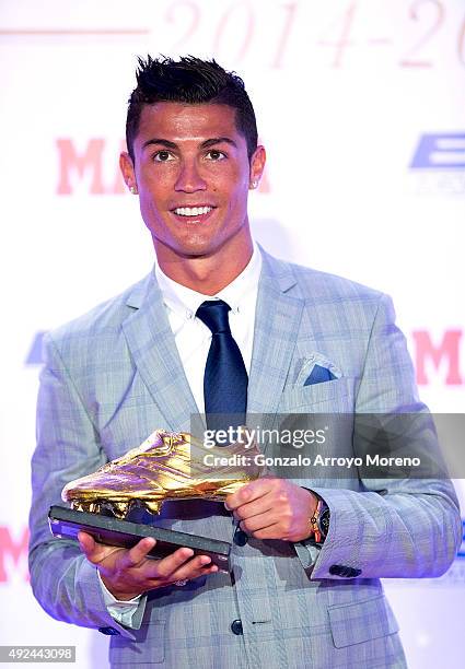 Real Madrid football player Cristiano Ronaldo poses with his fourth Golden Boot Award as maximun goal scorer of European leagues at The Westin Palace...