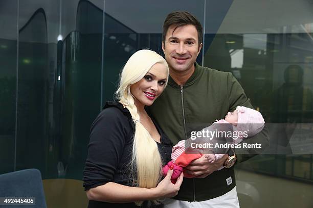 Daniela Katzenberger and Lucas Cordalis pose with their newborn daughter Sophia on October 13, 2015 in Cologne, Germany. It was first public...