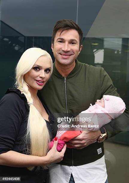 Daniela Katzenberger and Lucas Cordalis pose with their newborn daughter Sophia on October 13, 2015 in Cologne, Germany. It was first public...