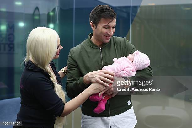 Daniela Katzenberger and Lucas Cordalis pose with their newborn daughter Sophia on October 13, 2015 in Cologne, Germany. It was first public...