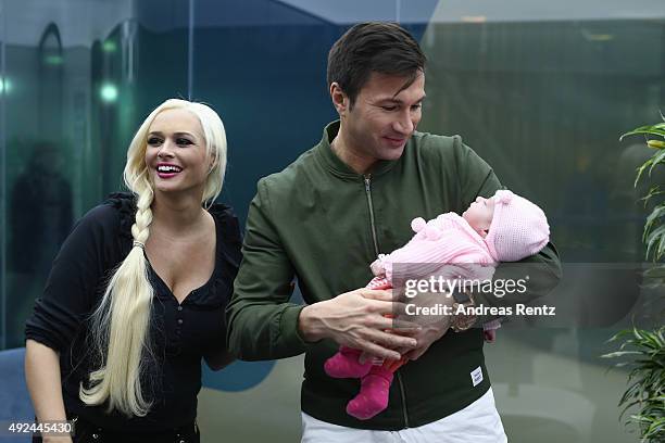 Daniela Katzenberger and Lucas Cordalis pose with their newborn daughter Sophia on October 13, 2015 in Cologne, Germany. It was first public...