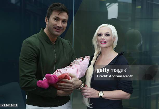 Daniela Katzenberger and Lucas Cordalis pose with their newborn daughter Sophia on October 13, 2015 in Cologne, Germany. It was first public...