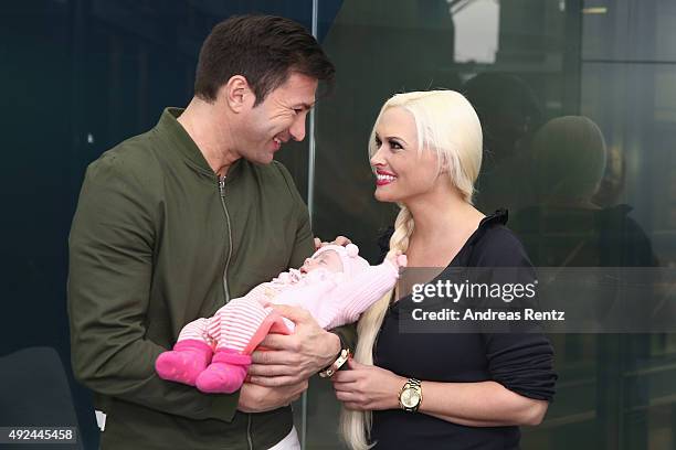 Daniela Katzenberger and Lucas Cordalis pose with their newborn daughter Sophia on October 13, 2015 in Cologne, Germany. It was first public...