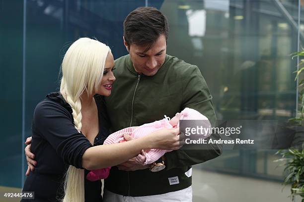 Daniela Katzenberger and Lucas Cordalis pose with their newborn daughter Sophia on October 13, 2015 in Cologne, Germany. It was first public...