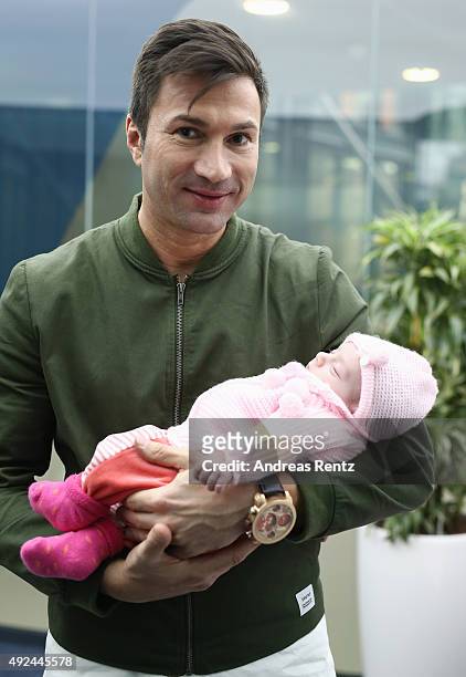 Lucas Cordalis poses with newborn daughter Sophia on October 13, 2015 in Cologne, Germany. It was first public appearance of the couple Daniela...