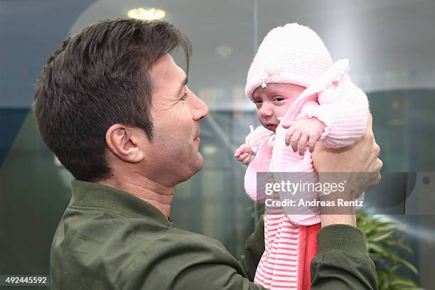 Lucas Cordalis poses with newborn daughter Sophia on October 13, 2015 in Cologne, Germany. It was first public appearance of the couple Daniela...