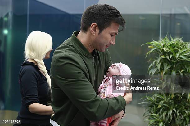 Lucas Cordalis poses with newborn daughter Sophia on October 13, 2015 in Cologne, Germany. It was first public appearance of the couple Daniela...