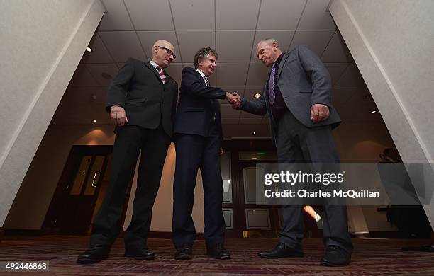 Jonathan Powell shakes hands with former UDA leader Jackie McDonald alongside Billy Hutchinson , PUP leader at the launch of the Loyalist Community...