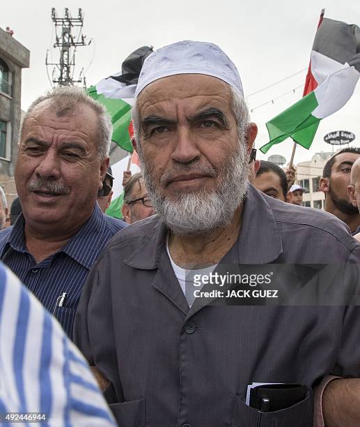 Arab Israeli Islamist leader Sheikh Raed Salah takes part in a large demonstration as part of a general strike organised to support the Palestinians...