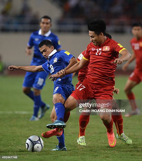 Thailand's Chanathip fights for the ball with Vietnam's Mac Hong Quan during a World Cup 2018 qualifier between Vietnam and Thailand on October 13,...