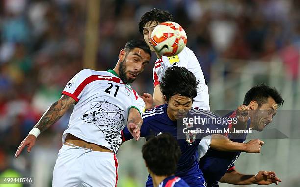 Sardar Azmoun and Ashkan Dejagah in action during the international friendly match between Iran and Japan at Azadi Stadium on October 13, 2015 in...