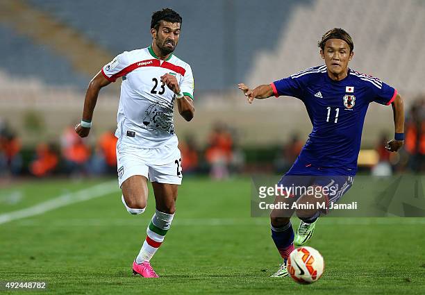 Ramin rezaeian and Usami Takashi in action during the international friendly match between Iran and Japan at Azadi Stadium on October 13, 2015 in...
