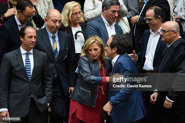 Catalonia's former Vice-President Joana Ortega is comforted by deputy and Convergencia Democratica de Catalunya member Josep Rull as she leaves...