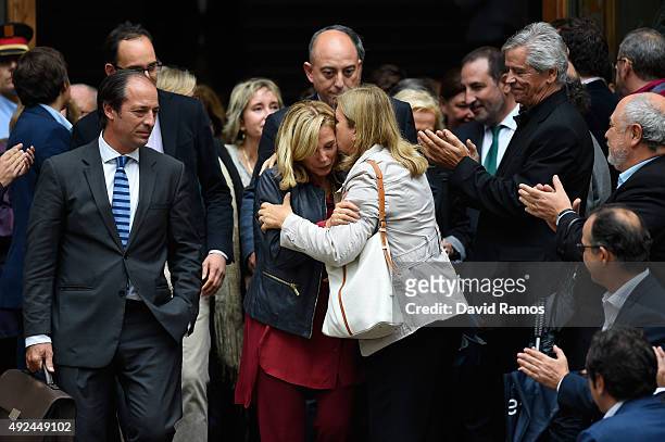Catalonia's former Vice-President Joana Ortega is comforted by supporters as she leaves Catalonia High Court after giving evidence on October 13,...