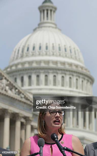 Rep. Kyrsten Sinema joins a group of bipartisan Congressmen during a news conference outside the U.S. Capitol May 20, 2014 in Washington, DC. The...