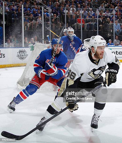 Joe Vitale of the Pittsburgh Penguins skates against John Moore of the New York Rangers in Game Six of the Second Round of the 2014 Stanley Cup...