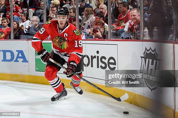 Jonathan Toews of the Chicago Blackhawks approaches the puck in Game Five of the Second Round of the 2014 Stanley Cup Playoffs against the Minnesota...