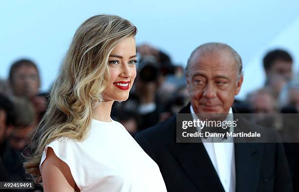 Amber Heard and Fawaz Gruosi attends the "Two Days, One Night" Premiere at the 67th Annual Cannes Film Festival on May 20, 2014 in Cannes, France.