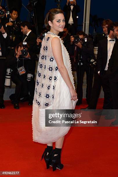 Marion Cotillard leaves the "Two Days, One Night" premiere during the 67th Annual Cannes Film Festival on May 20, 2014 in Cannes, France.