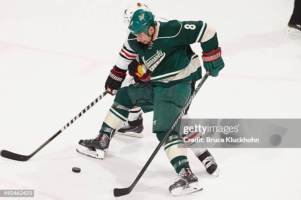 Cody McCormick of the Minnesota Wild and Duncan Keith of the Chicago Blackhawks battle for the puck during Game Six of the Second Round of the 2014...
