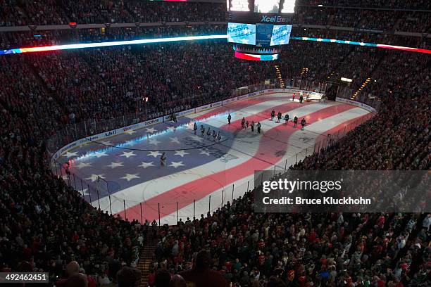 An American flag is projected onto the ice during the national anthem prior to Game Six of the Second Round of the 2014 Stanley Cup Playoffs between...