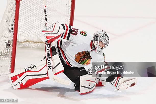 Corey Crawford of the Chicago Blackhawks makes a save against the Minnesota Wild during Game Six of the Second Round of the 2014 Stanley Cup Playoffs...