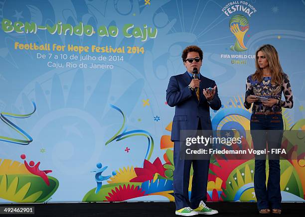 Romero Britto and Fernanda Lima visit the Launch of the Fotball for Hope Festival on May 20, 2014 in Rio de Janeiro, Brazil.