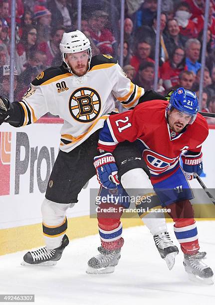 Brian Gionta of the Montreal Canadiens and Kevan Miller of the Boston Bruins battle for the puck in Game Four of the Second Round of the 2014 Stanley...