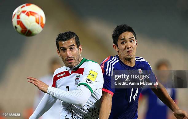 Ehsan Hajsafi and Muto Yoshinori in Action during the international friendly match between Iran and Japan at Azadi Stadium on October 13, 2015 in...