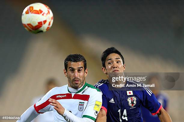 Ehsan Hajsafi and Muto Yoshinori in Action during the international friendly match between Iran and Japan at Azadi Stadium on October 13, 2015 in...