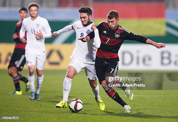 Maximilian Dittgen of Germany is challeged by Matt Grimes of England during the U20 Mercedes-Benz Elite Cup match between Germany and England at...