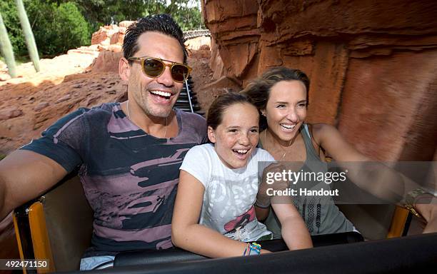 In this handout photo provided by Disney Parks, actor Cristian de la Fuente, wife and actress Angelica Castro and their daughter Laura de la Fuente...