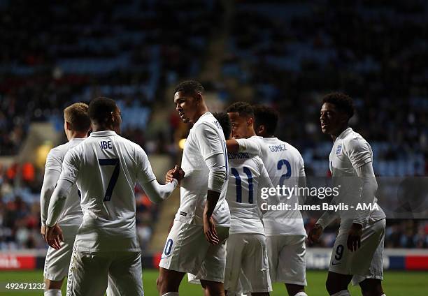 Ruben Loftus-Cheek of England U21 celebrates with his team-mates after scoring a goal to make it 1-0 during the European Under 21 Qualifier between...