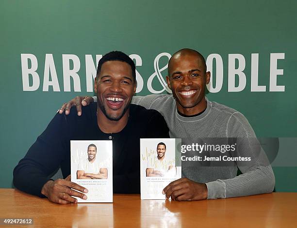 Media personality Michael Strahan and Dr. Ian Smith pose for a photo during the book signing for Michael Strahan's book "Wake Up Happy: The Dream...