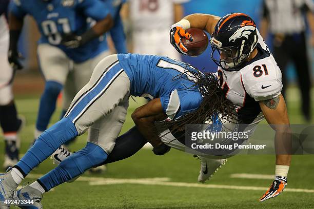 Tight end Owen Daniels of the Denver Broncos is tackled by cornerback Rashean Mathis of the Detroit Lions at Ford Field on September 27, 2015 in...
