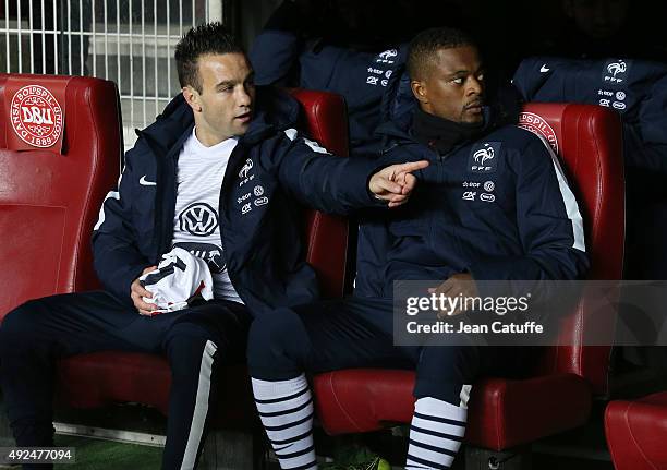 Mathieu Valbuena and Patrice Evra of France attend the international friendly match between Denmark and France at Telia Parken Stadium on October 11,...
