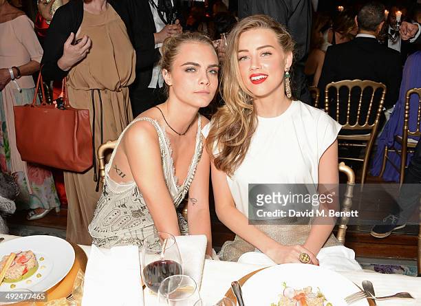 Cara Delevingne and Amber Heard attend the de Grisogono 'Fatale In Cannes' party during the 67th Cannes Film Festival at Hotel du Cap-Eden-Roc on May...