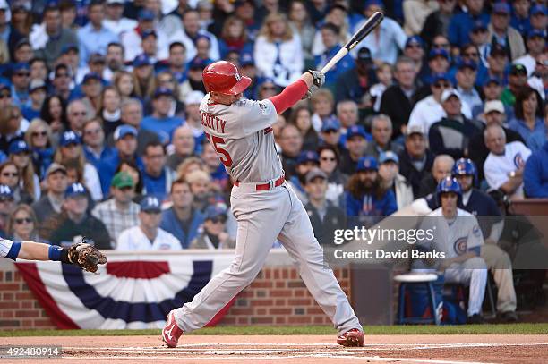 Stephen Piscotty of the St. Louis Cardinals hits a two-run home run in the first inning against the Chicago Cubs during game four of the National...