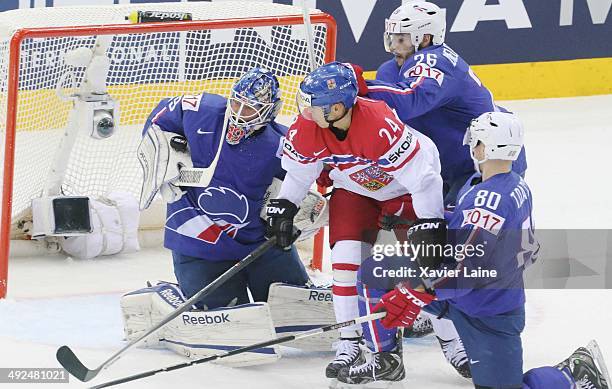 Jiri Hudler of Czech Republic and Florian Hardy, Benjamin Dieude-Fauvel and Teddy Da Costa of France in action during the 2014 IIHF World...