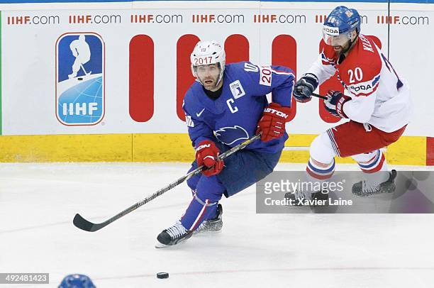 Captain Laurent Meunier of France and Jakub Klepis of Czech Republic in action during the 2014 IIHF World Championship between France and Czech...