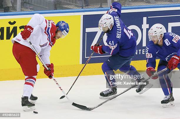 Michal Jordan of Czech Republic and Pierre-Edouard Bellemare and Jonathan Janil of France in action during the 2014 IIHF World Championship between...