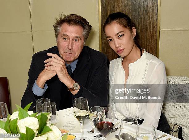 Bryan Ferry and Yi Zhou attend the Deconstructed Project with a private dinner hosted by Caroline Issa, David Shrigley and Massimo Nicosia on October...