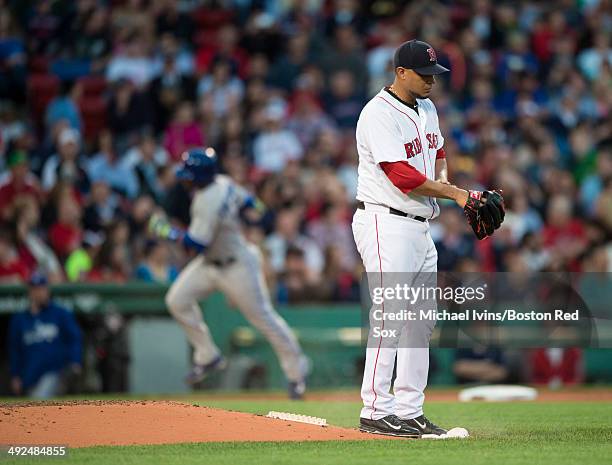 Felix Doubront of the Boston Red Sox steps off the mound after allowing a home run to Edwin Encarnacion of the Toronto Blue Jays in the third inning...