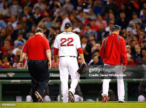 Felix Doubront of the Boston Red Sox walks off of the field after leaving with an injury in the fifth inning against the Toronto Blue Jays during the...