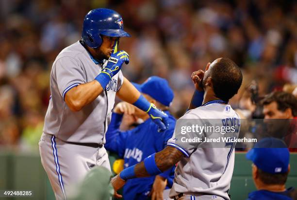 Melky Cabrera of the Toronto Blue Jays celebrates his solo home run in the sixth inning with teammate Jose Reyes against the Boston Red Sox during...