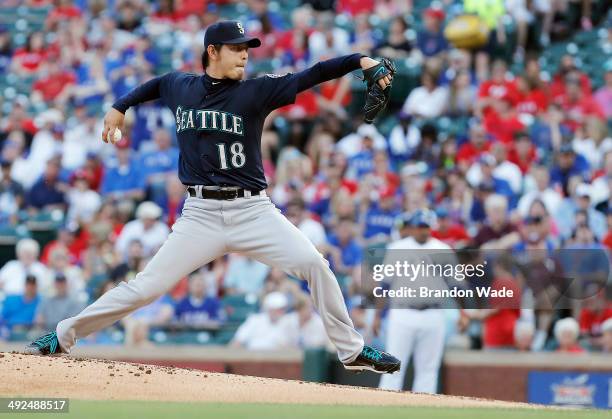 Starting pitcher Hisashi Iwakuma of the Seattle Mariners throws during the first inning of a baseball game against the Texas Rangers at Globe Life...