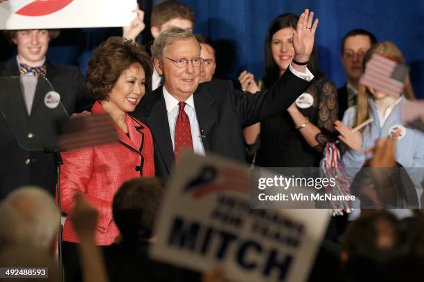 Senate Republican Leader Sen. Mitch McConnell and his wife Elaine Chao wave to supporters after a victory celebration following McConnell's victory...