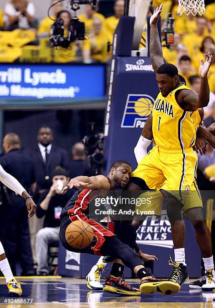 Dwyane Wade of the Miami Heat loses the ball as Lance Stephenson of the Indiana Pacers defends during Game Two of the Eastern Conference Finals of...